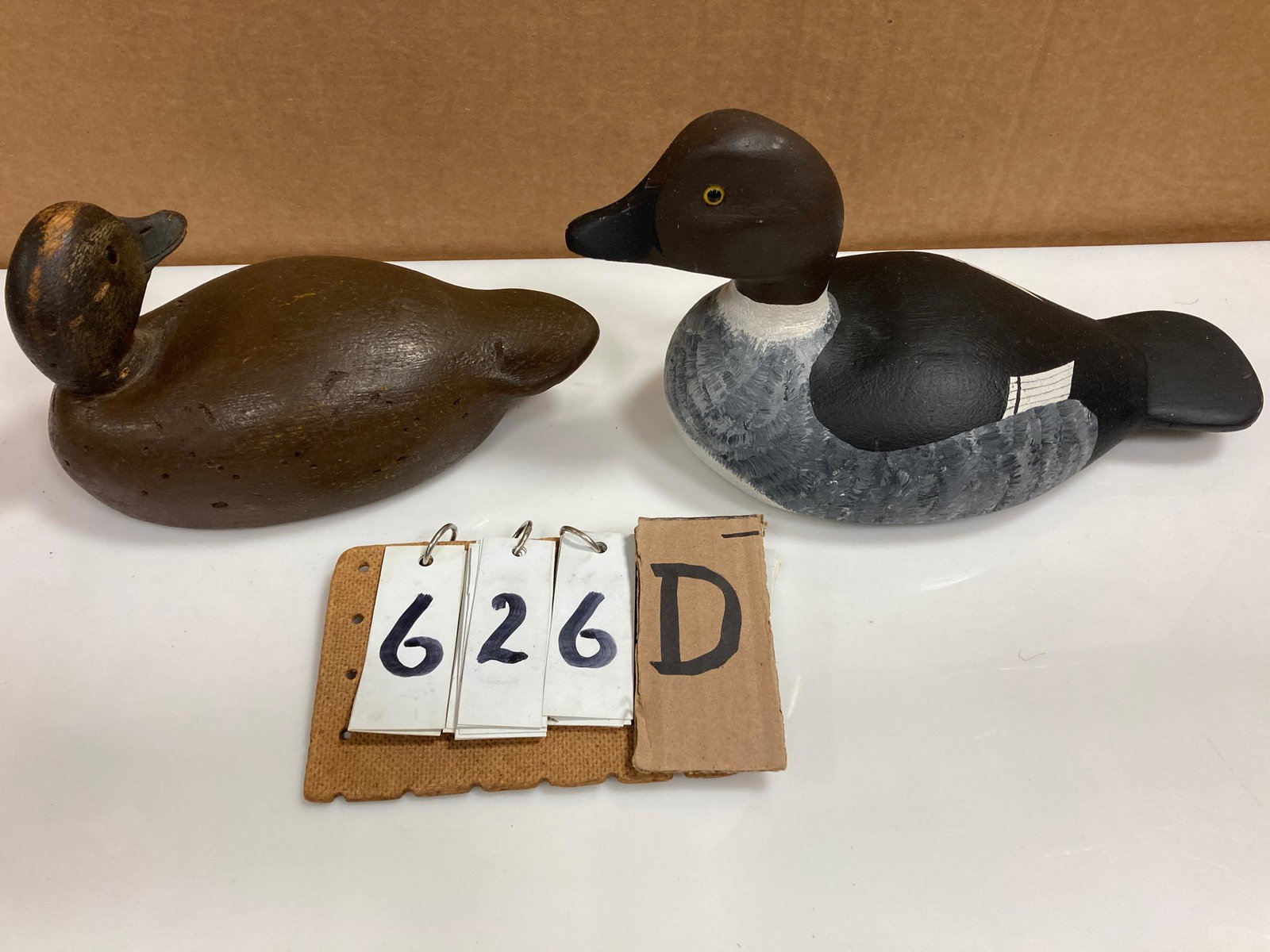 Two Hand Carved Wood Duck Decoys: Two hand carved and hand painted wood duck decoys. Includes one bufflehead drake carved by Bill Hollis and one mallard hen. From the collection of one family in St. Lawrence County, NY who loved the A