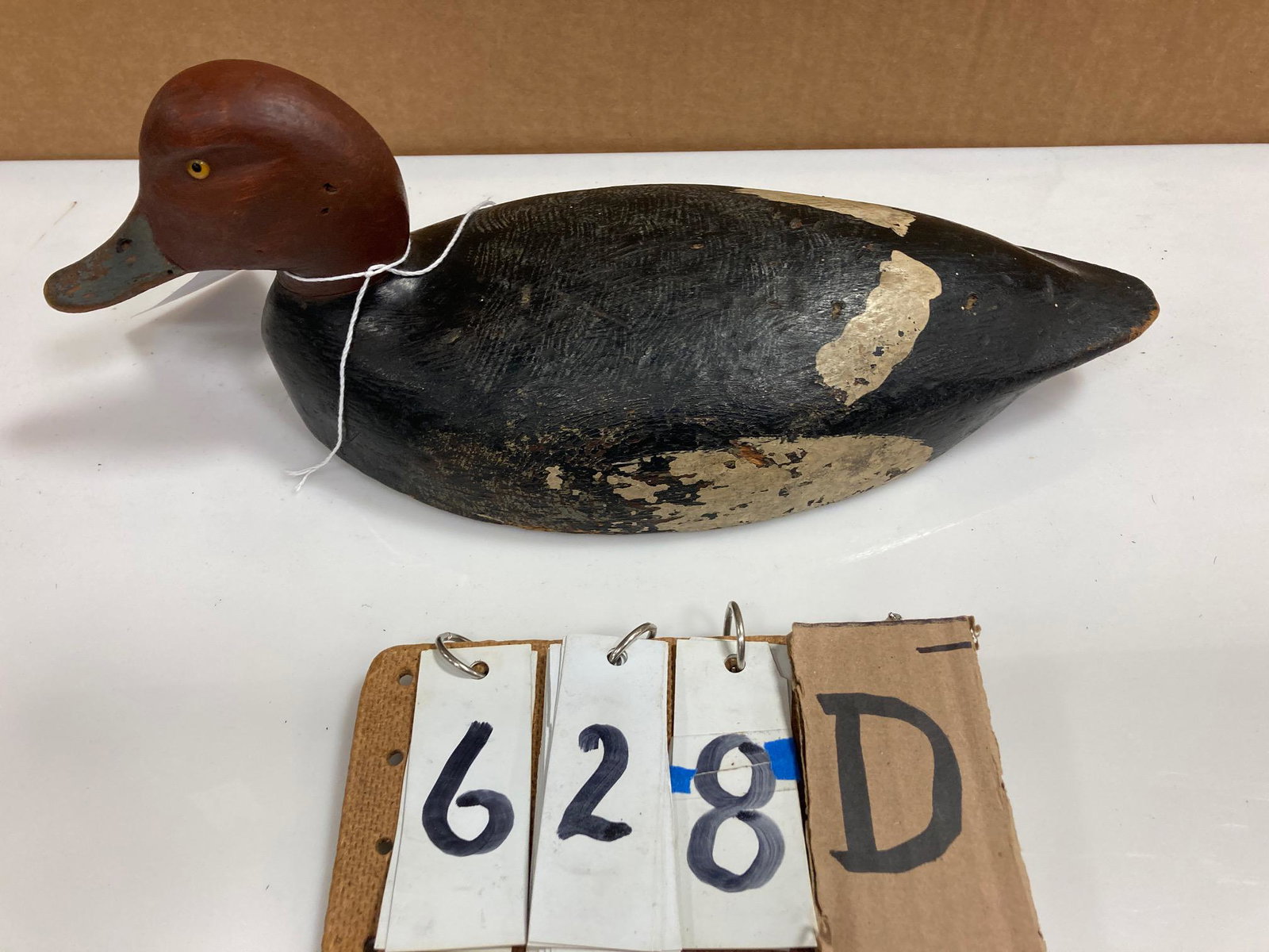 One Hand Carved Wood Duck Decoy: One hand carved and hand painted wood duck decoy of a redhead drake carved by Sam Denny of Clayton, NY. From the collection of one family in St. Lawrence County, NY who loved the Adirondacks and every