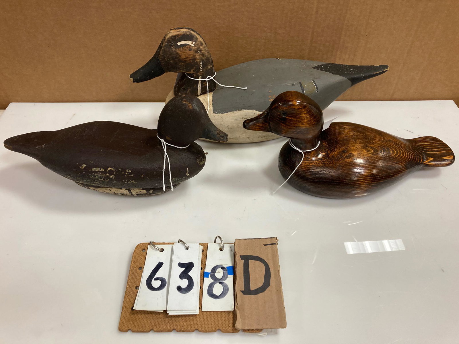 Three Hand Carved Wood Duck Decoys: Three hand carved and hand painted wood duck decoys. Includes one pintail drake, one bluebill hen with weight circa 1900 and one nicely done decorative mallard. From the collection of one family in St