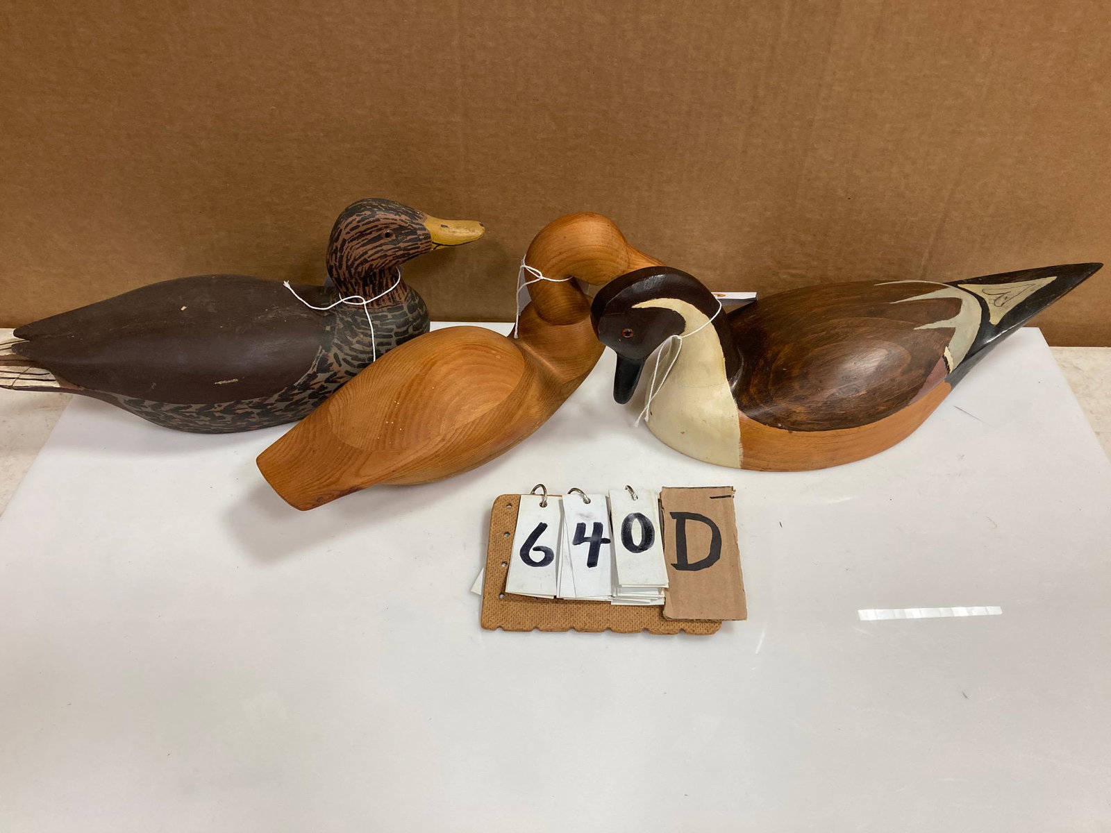 Three Hand Carved Wood Duck Decoys: Three hand carved and hand painted wood duck decoys. Includes one pintail drake carved by R. Hunter, one mallard hen carved by Scott and one decorative unpainted decoy. From the collection of one fami