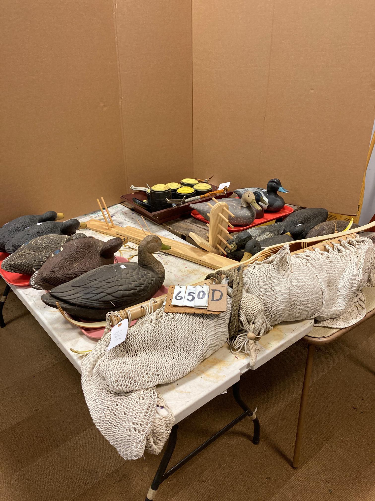 20 Miscellaneous Outdoors Items: 20 miscellaneous outdoors items. Includes 15 plastic duck decoys, 2 hand held skeet throwers with 50+ clay pigeons, 1 L.L. Bean hammock, 1 Palomino laminated wood bow marked Ben Pearson, 1 Ben Pearson