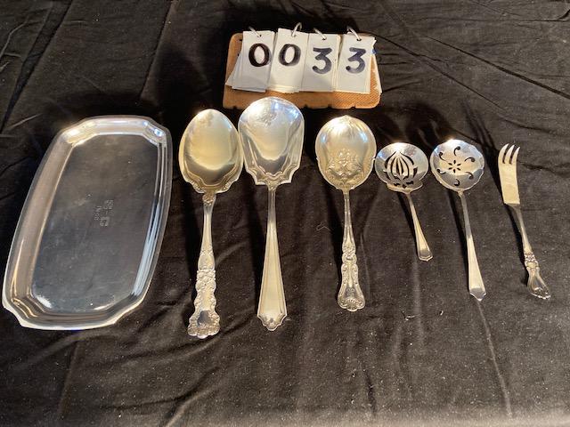 Sterling Silver Tray and Six Flatware Pieces: Sterling silver tray and six flatware pieces. (1-Tray) J.E. Caldwell & Co., (1) Alvin, (1) Pat. Mar. 7. 99, (1) Patd. 6.17.13 and (3) unknown. 14.81 troy oz. total weight. Please read the Terms and Co