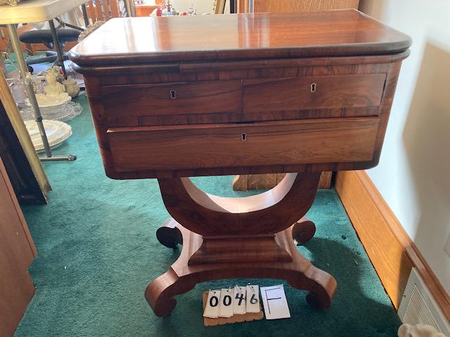 1860s American Empire 2 Drawer Swivel Top Sewing Cabinet: 1860s Mahogany American Empire 2 Drawer Swivel Top Sewing Cabinet. There is a secret compartment when top swivels, when open it also creates a larger table 24 1/2" w x 14" d x 29 1/2" t