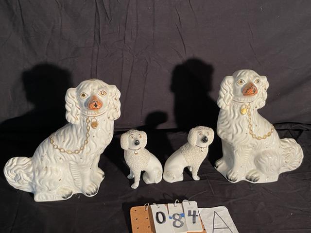 Four 1900s Staffordshire Porcelain Poodles: Four 1800s Staffordshire porcelain poodles, two pairs. One pair of large 19c Staffordshire porcelain poodles in excellent condition with beautiful gold collars and hand painted mint condition faces (v