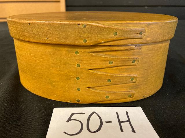 Five Finger Shaker Pantry Box with Lid: Small oval five finger shaker pantry box with lid. Has yellow paint. 0.5" slit/crack near nail on rim of cover. Top finger on box is missing a 0.25" piece of wood. 6.5"l x 4.25"w x 2.75"h with lid. Pl