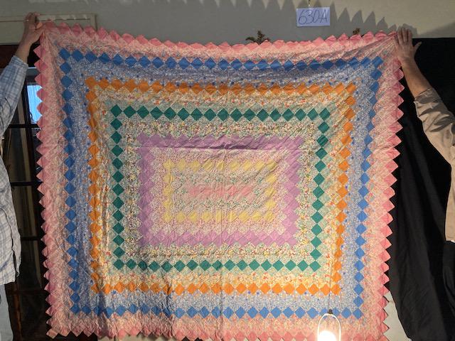 2 Matching Handdone Handsewn Patchwork Quilts: 2 19c Matching beautiful ruffled edge patchwork quilts all hand sewn with green, pink, and multi colors on an ivory front background and green opposite side background both in excellent condition meas