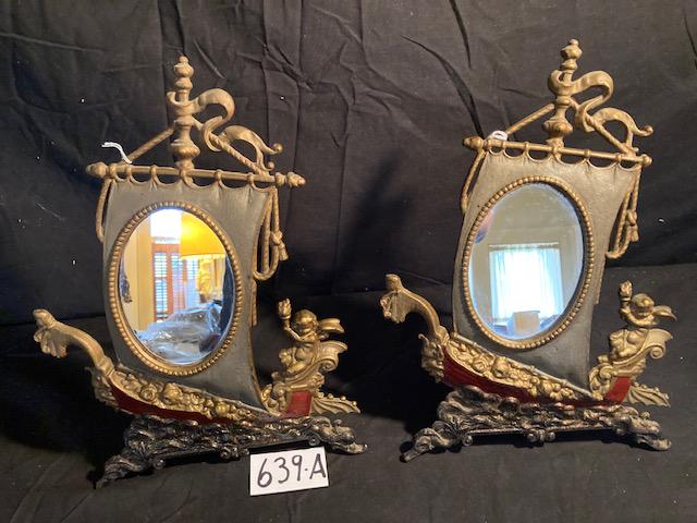 Matching Pair of 1890s-1900s Cast Iron Table Mirrors: American boudoir figural table mirrors with viking boat, winged cherubs with torch in hand steering the sailboat. In 50+ years I have never seen this example. They both have a metal stand on the back