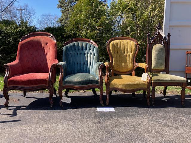 Four 1860s Victorian Carved Arm Chairs: Four 1860s Victorian solid walnut upholstered American finger and fruit carved arm chairs. One has a Gothic carved fancy crest. Red is 26.5"w x 22.5"d x 43.25"h. Yellow is 24.5"w x 20.5"d x 40.5"h. Gr