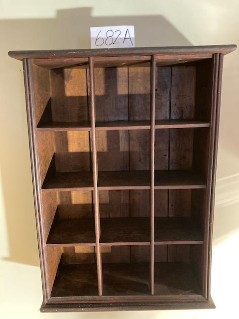12 Cubby 19c Solid Oak Hanging Wall Shelf: 12 cubby 19th century solid oak hanging wall shelf or mustache cup holder. 18.75"w x 7"d x 25.5"h. Please read the Terms and Conditions of this auction thoroughly for IMPORTANT bidder information.