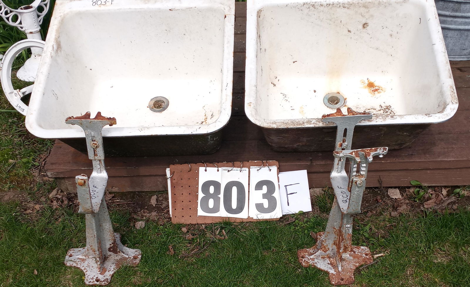 Nine Metal Tubs and Miscellaneous Cast Iron Sinks: Nine metal tubs and miscellaneous cast iron sinks. Five galvanized wash tubs and two cast iron white enamel sinks with stands. Please read the Terms and Conditions of this auction thoroughly for IMPOR