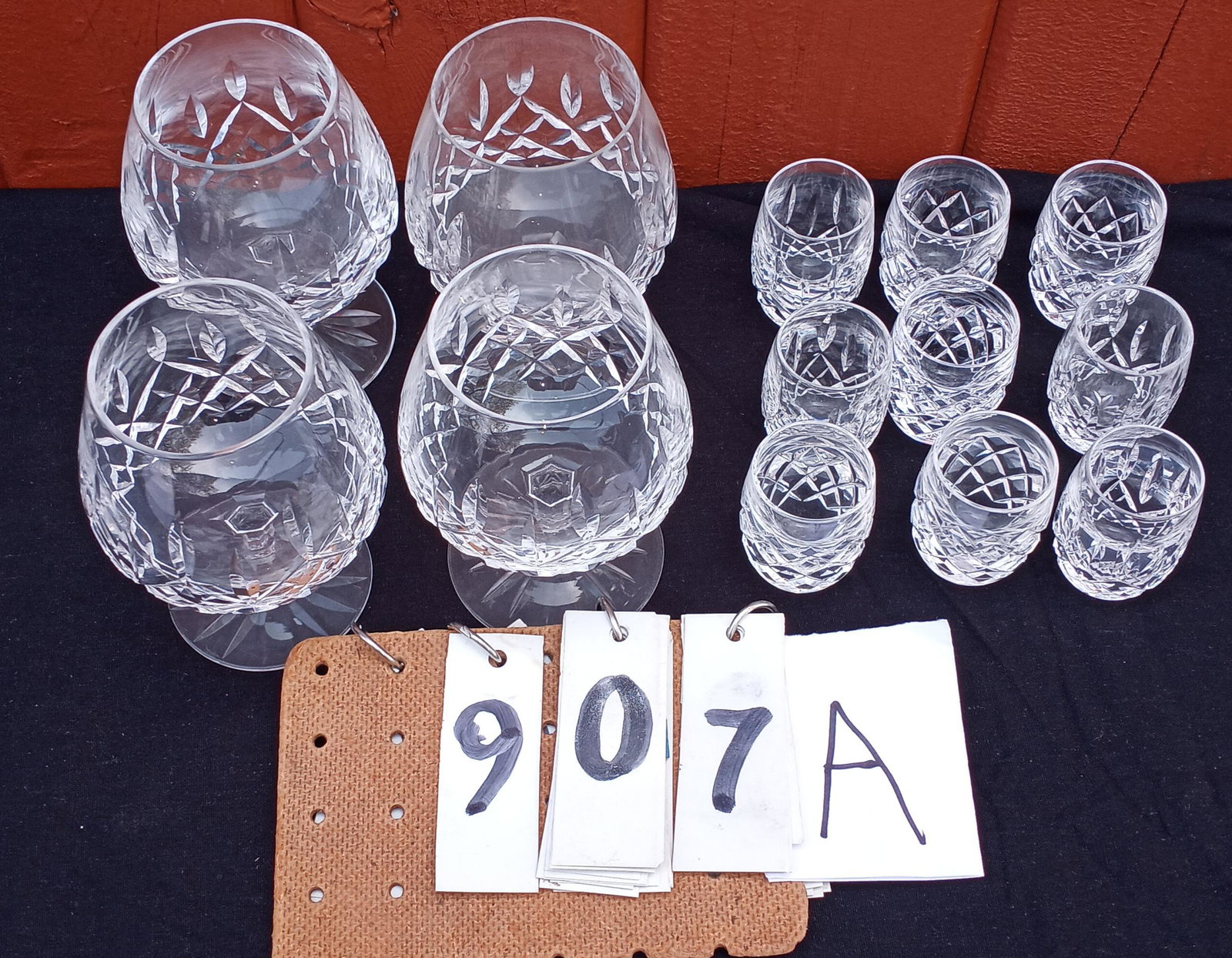 13 Signed Waterford Cut Crystal Pieces: 13 signed Waterford cut crystal pieces. Four matching brandy glasses 3.5"w x 5.125"h. Nine matching shot glasses 1.625"w x 2.375"h. All in excellent condition. Please read the Terms and Conditions of 