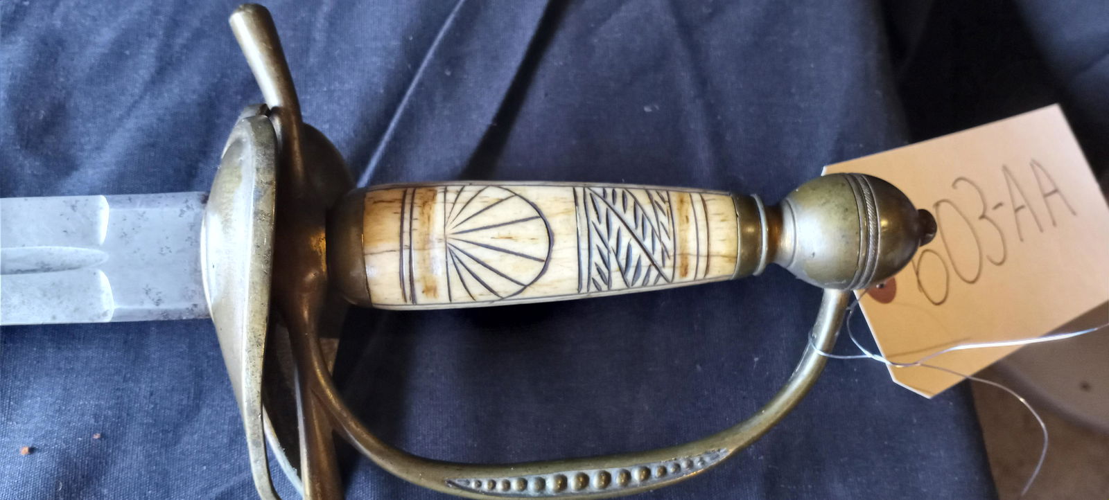 N.P. Ames Early American Sword with Carved Handle: N.P. Ames early 1800s American sword with carved bone(?) handle. The Ames signature is hand engraved and original to the sword. In the middle of the sword hand engraved are the words E PLURIBUS UNUM.