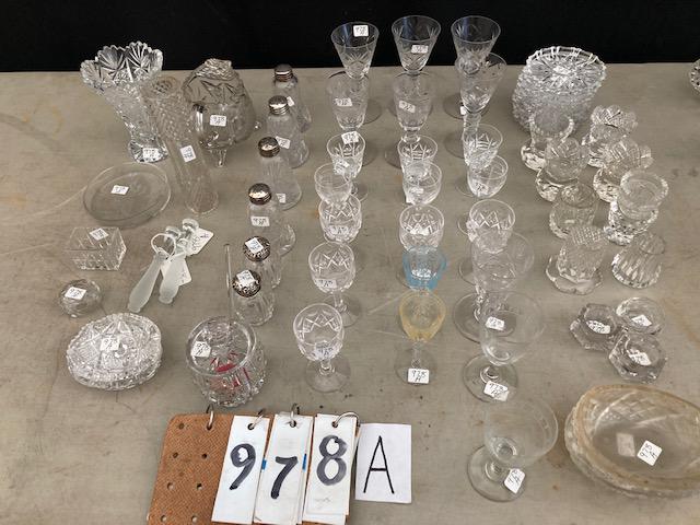 58 American Cut Glass Pieces: 58 American brilliant cut glass pieces. Includes sterling covered salt and peppers, vases, cordials, coasters and much more. See photos. Please read the Terms and Conditions of this auction thoroughly
