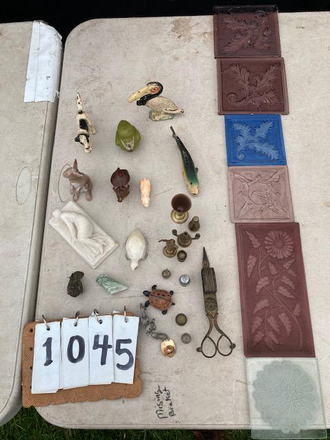 29 Antique Miniature Figurines: 29 antique miniature figurines. One bronze 19th century bird. One cast iron pelican bottle opener. Three cast iron pieces (dog, fish and bird). Six glass 19th century tiles. Alabaster carving of a wom