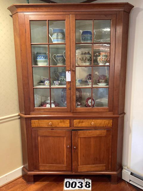1830s American Tiger Maple Corner Cupboard: Beautiful American 1830s solid tiger maple two-part corner cupboard. With two window pane glass doors, two raised panel doors and two dovetailed early drawers. Expertly refinished condition with some