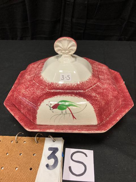 Red Spatter China Parrot Pattern Vegetable Dish: Rare Red Spatter China Parrot Pattern Covered Vegetable Dish. 7"h. x 11"w. Condition: Fair with cracks and repairs. Spatterware and Mocha China cataloged by Jeff Dehart of Conestoga Auction Company, M