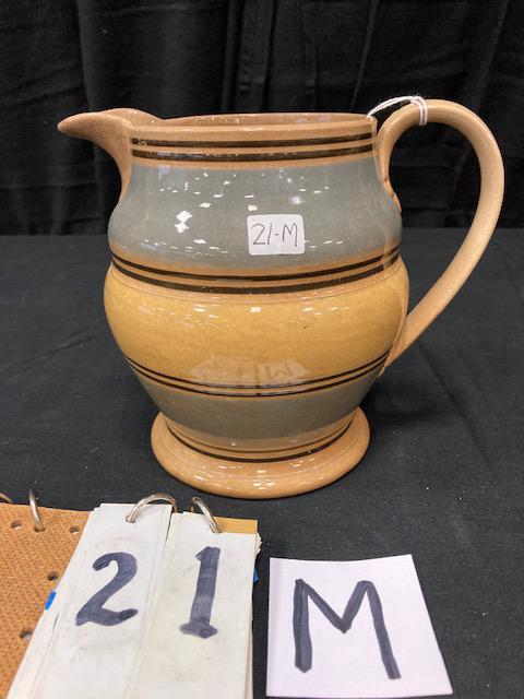 Mochaware China Pitcher with Band Decoration: Mochaware China Pitcher with Band Decoration. 7"h. Condition: Good with stains. Spatterware and Mocha China cataloged by Jeff Dehart of Conestoga Auction Company, Manheim, Pa. From the Hinkle Estate o