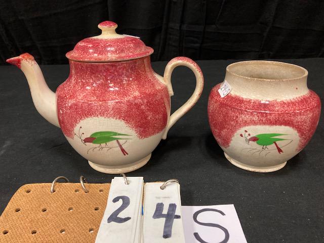 Two Pieces of Red Spatter China Parrot Pattern: Two Pieces of Red Spatter China Parrot Pattern. 7-1/4" teapot and 4-3/4" sugar bowl. Condition: Good with repairs, sugar is missing it's lid. Spatterware and Mocha China cataloged by Jeff Dehart of Co