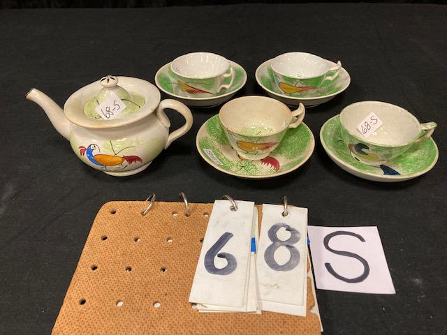 Green Spatter China Peafowl Pattern Child's Tea Set: Green Spatter China Peafowl Pattern Child's Tea Set. 3-3/4" teapot and four cups and saucers. Condition: Good with some minor chips and hairlines, teapot has a small chip repair on spout. Spatterware