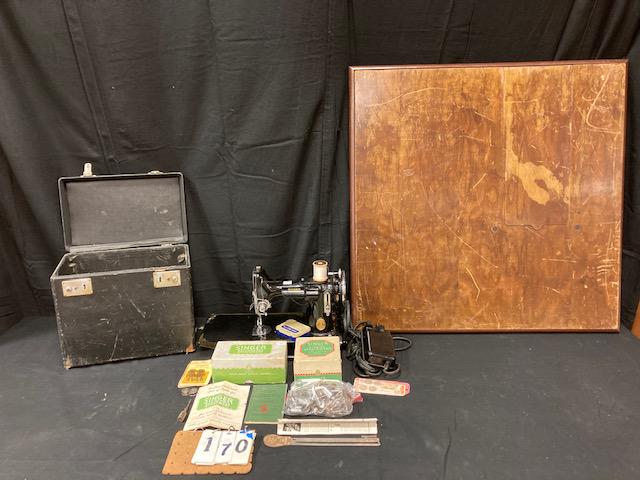 Rare Singer Featherweight Sewing Machine: Rare Singer Featherweight sewing machine with original folding wood leg card table exclusively for this machine. It is very hard to find the original stand. It has many extra attachments as well (see