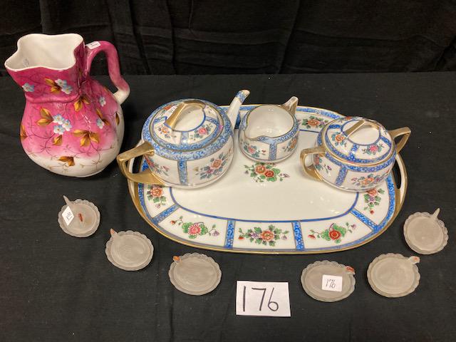 11 Antique Glass and Porcelain Items: 11 antique glass and porcelain items. Four piece signed Nippon floral tea set with 16"l x 11.25"w tray, tea pot, sugar and creamer. Six 1920s miniature matching pressed glass hens on nests. One nice s