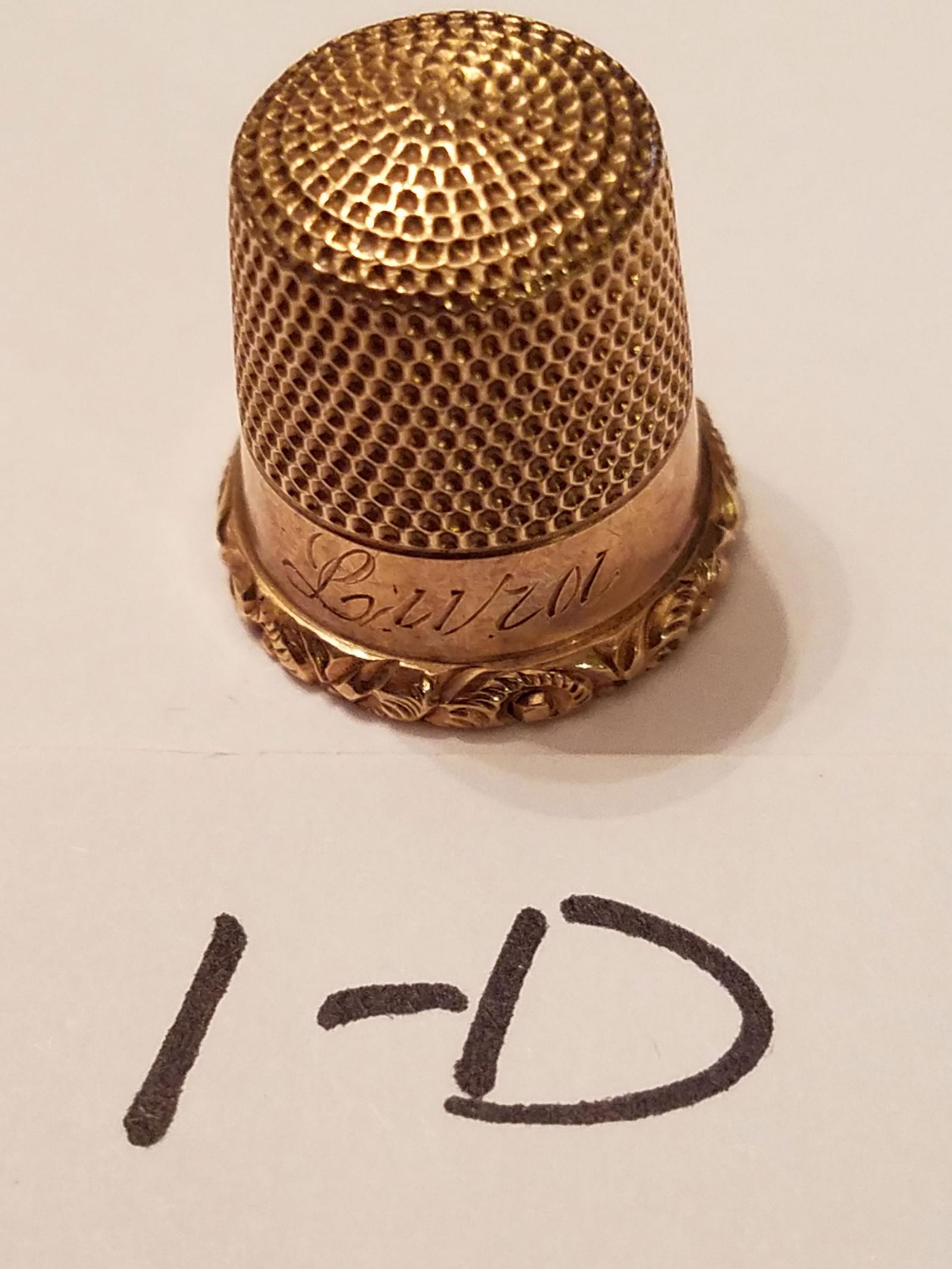 1890s 14K Gold Thimble: Nice circa 1890s 14K gold tested thimble. Signed LURA. 2.2 dwt total weight. Please read the Terms and Conditions of this auction thoroughly for IMPORTANT bidder information.