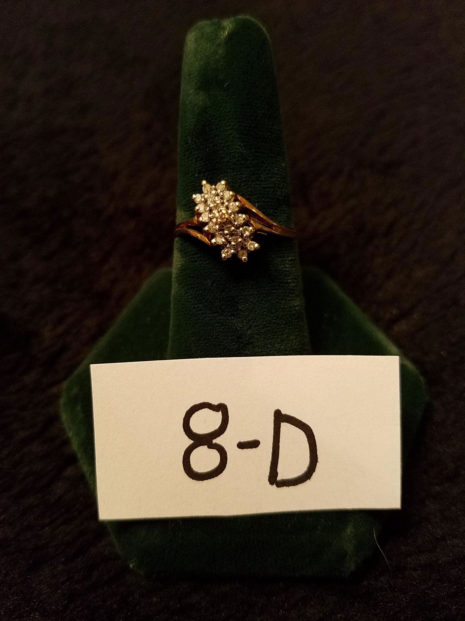 10K Gold and Diamond Ring: 10K gold ring with 18 diamonds. Size approx. 7.5. 1.3 dwt total weight including stones. Please read the Terms and Conditions of this auction thoroughly for IMPORTANT bidder information.
