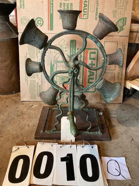 Ten Matching Solid Brass 19c Indonesian Revolving Bells: Ten matching solid brass 19th century Indonesian revolving bells on a wood stand. 17"w x 21"h x 9.5"d. From the Poland, NY Estate. Please read the Terms and Conditions of this auction thoroughly for I