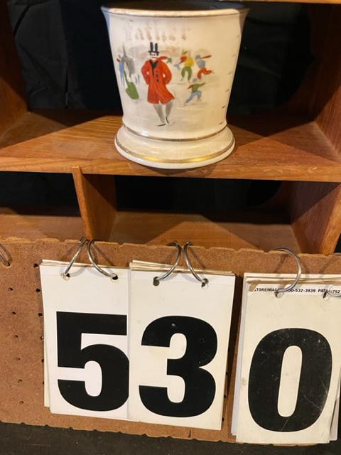 Two 19c Occupational Shaving Mugs: Two 19th century hand painted occupational shaving mugs. One milkman, chipped, 4.5"w x 3.375"h. One skater - owner Father, 4.75"w x 3.75"h. These occupational shaving mugs are from a collection that w