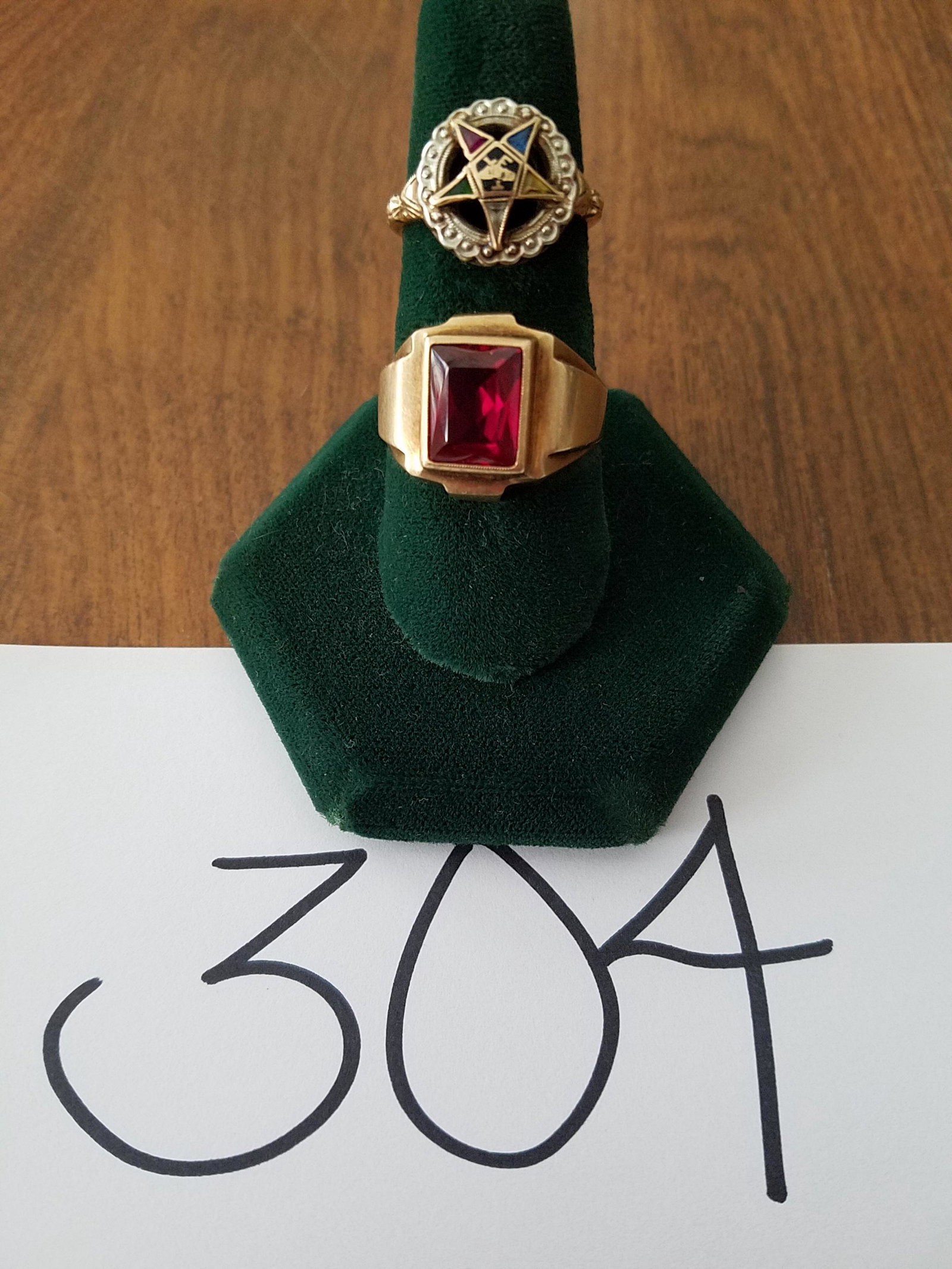 Two 10K Gold Rings: Two 10K gold rings. One 10K gold ladies masonic ring with blue, red, yellow, green and clear stones, approx. size 5.75. One 10K gold ring with red stone, approx. size 10. Total weight including stones