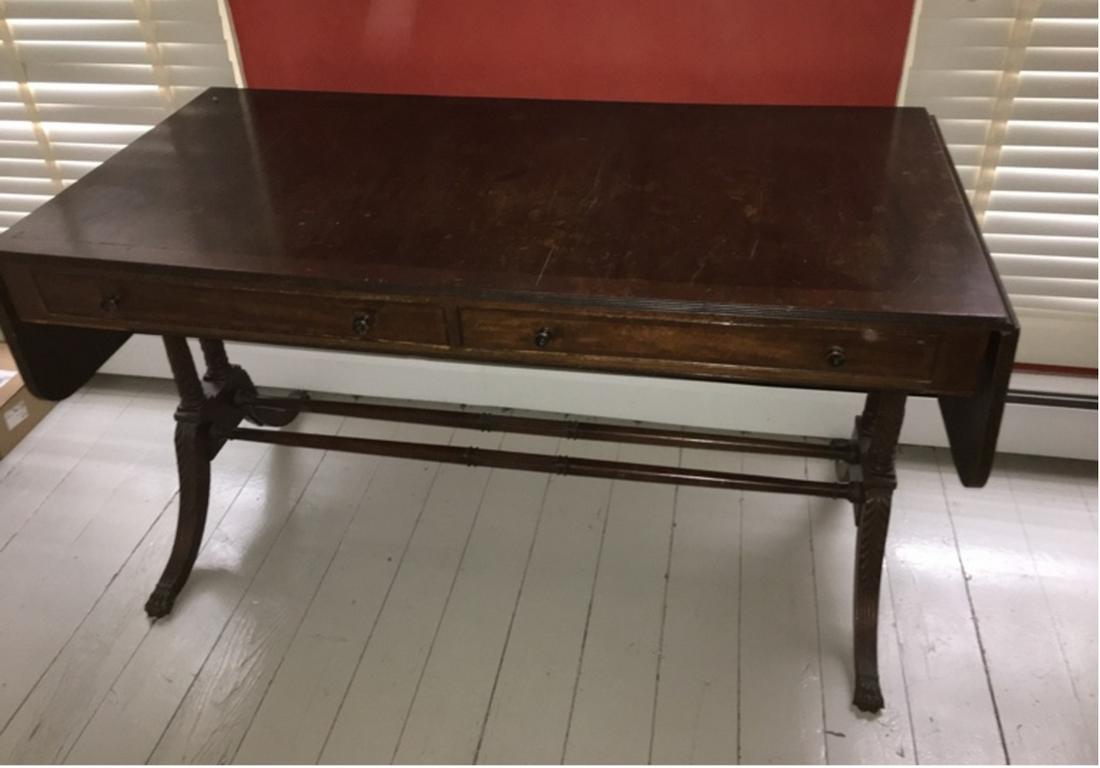 1920s American Mahogany Duncan Phyfe Drop Leaf Table: 1920s American mahogany Duncan Phyfe two-drawer drop leaf table. 74"l x 26.5"w x 30"h. Please read the Terms and Conditions of this auction thoroughly for IMPORTANT bidder information.
