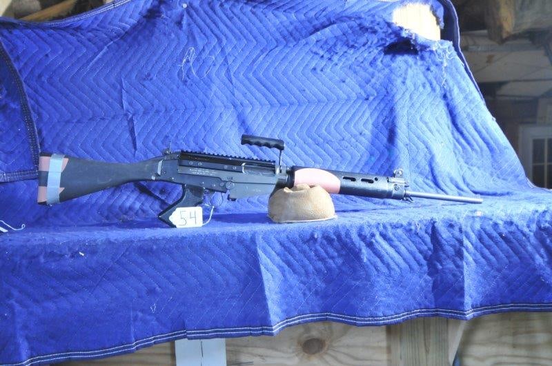 DSA Arms/CAI L1A1 Rifle: DSA Arms/CAI L1A1 Rifle. 308 Winchester. 21" barrel. Pink areas are sandpaper grips glued on. Serial No. 117238. NOT NY COMPLIANT.
