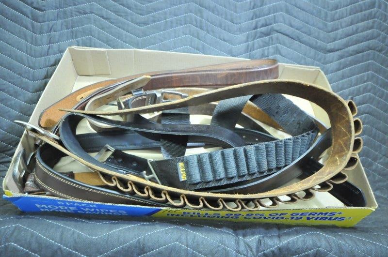 Box Lot of Belts: Box lot of belts. Two ammo belts - one leather and one cloth. Four jeans belts. See photos.