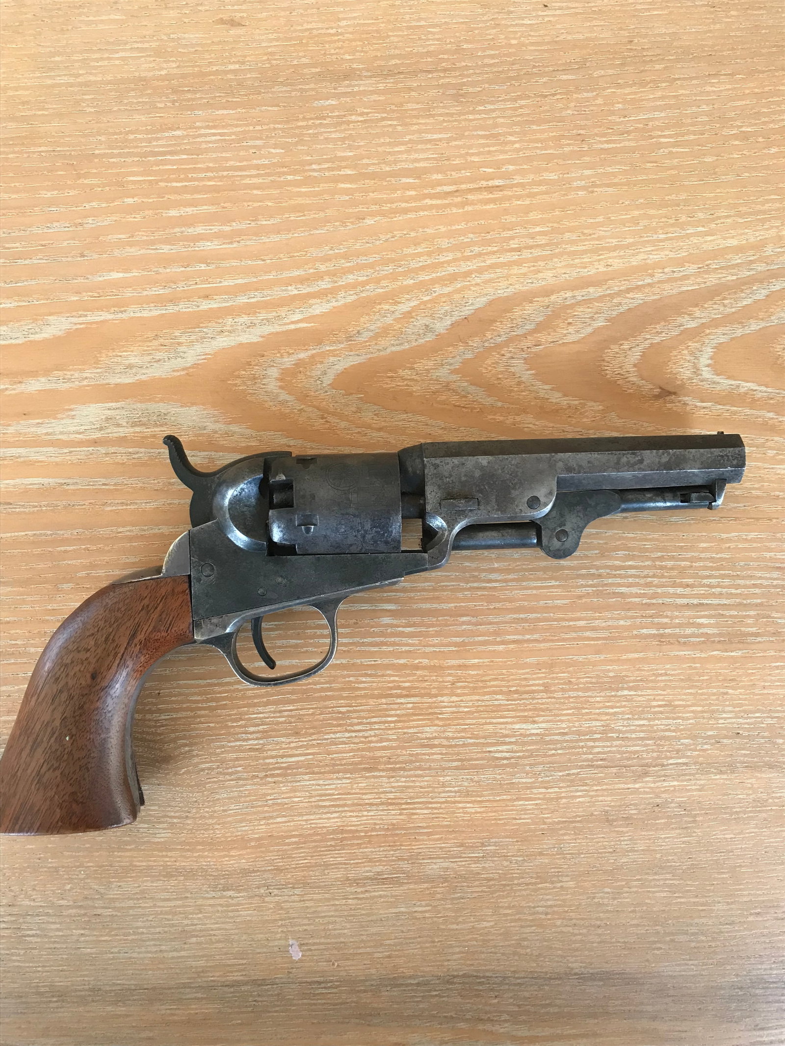 Colt Model 1849 Pocket Pistol: Colt Model 1849 pocket pistol. 31 caliber, five shot cylinder. 4" barrel with attached loading lever. Barrel marked "Address Saml Colt, New York City". Much of the silver is remaining on the upper and