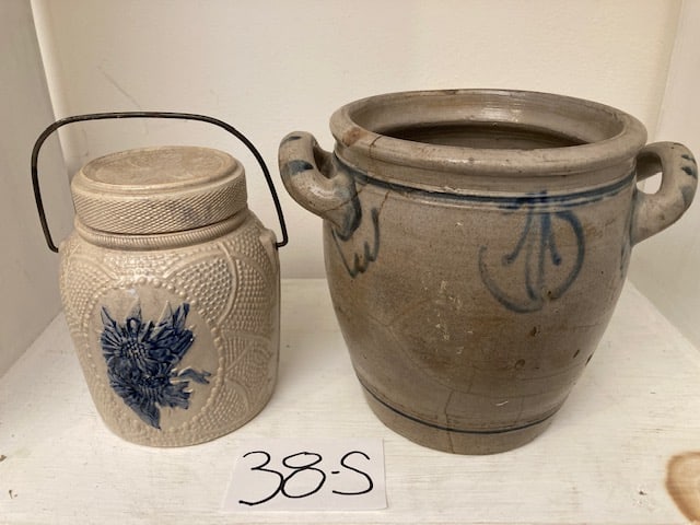 Stoneware Cover Jar and Crock: Stoneware covered jar and crock. One nice Whites of Utica covered jar with bail handle. Has chip on the cover. 5"w x 6.25"h. One PA crock with pierced handles and blue decoration. Has cracks. 9"w x 7.