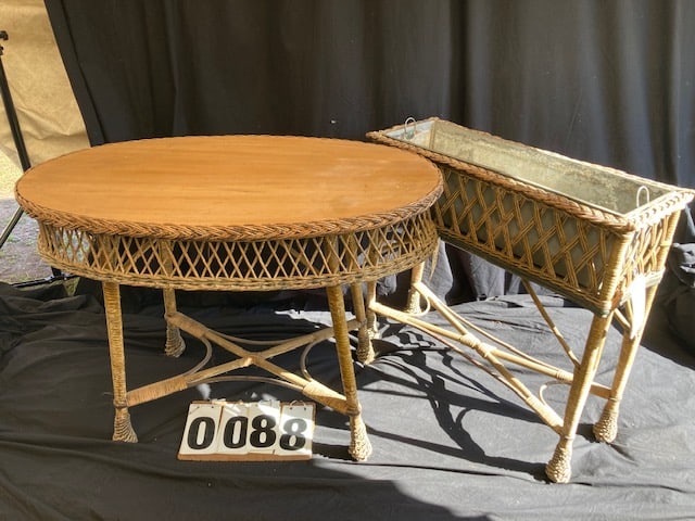 Two Antique Wicker Furniture Pieces: Two antique wicker furniture pieces. One 1900's oval table - 41"l x 22.75"w x 29.75"h. One tin lined planter - 31"l x 11.25"w x 30"h.