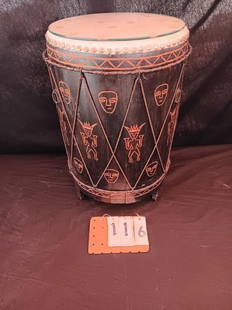 Circa 1900's Hand Carved African Drum: Circa 1900's hand carved African drum with carved faces around the circumference. It has a glass top and can be used as a table. 13.5"l x 20.5"h. From the Potsdam, NY Estate.