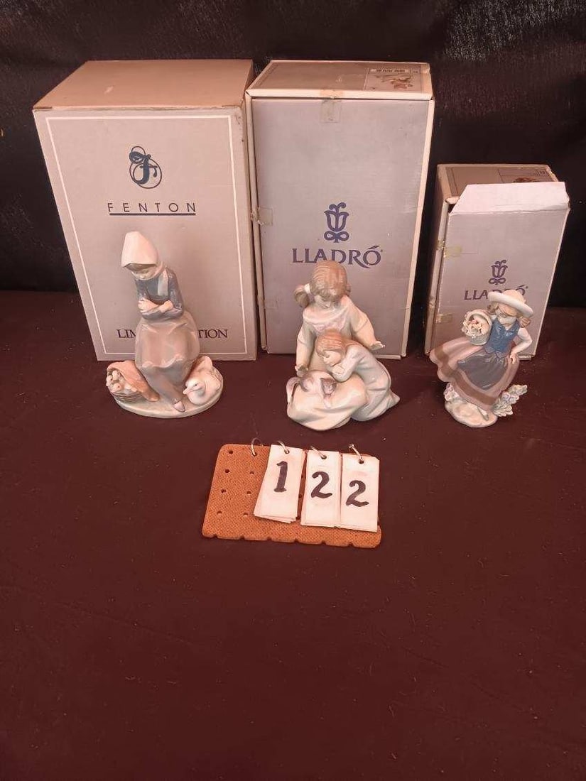 Three Lladro Porcelain Figurines: Three Lladro porcelain figurines with boxes. One handmade, made in Spain #1267, E-29A H and other marks. See photos. 5"l x 4.25"w x 8.5"h. One handmade, made in Spain 1987, #1304, 225 B11F and other m