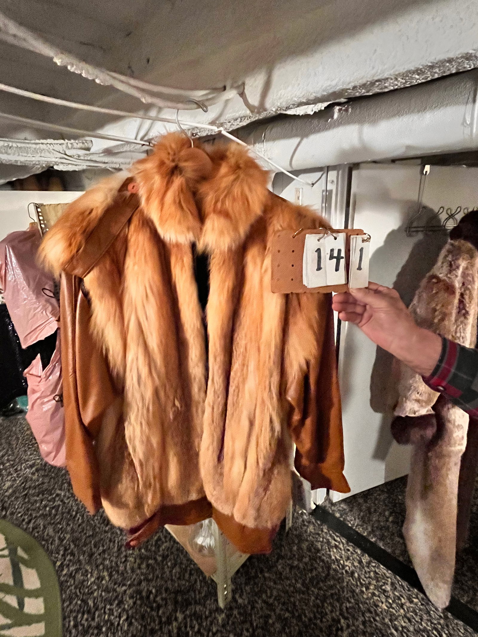 Dero by Rocco, NY Leather and Red Fox Fur Coat.: Dero by Rocco, NY leather and red fox fur coat. Size small. Brand new with tags still on it. Dero Enterprise. Slip off zipper sleeves. 42"l x 21"w with 20" sleeves. From the Rochester, NY Estate.