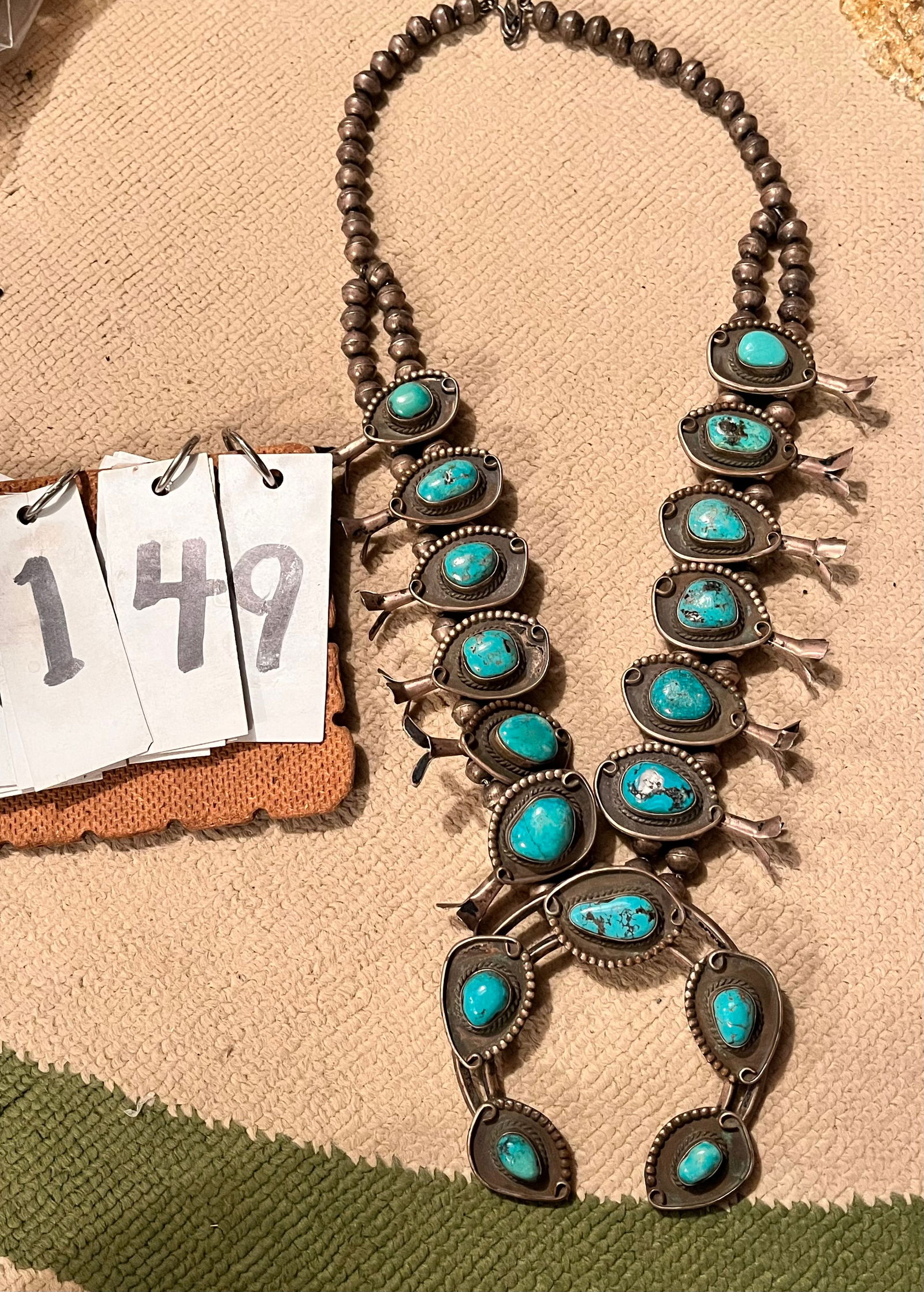 Antique Native American Silver Squash Blossom Turquoise Necklace: Antique Native American silver squash blossom turquoise necklace. No signature found. 26" chain. Amulets ar 3.5"w. From the Rochester, NY Estate.