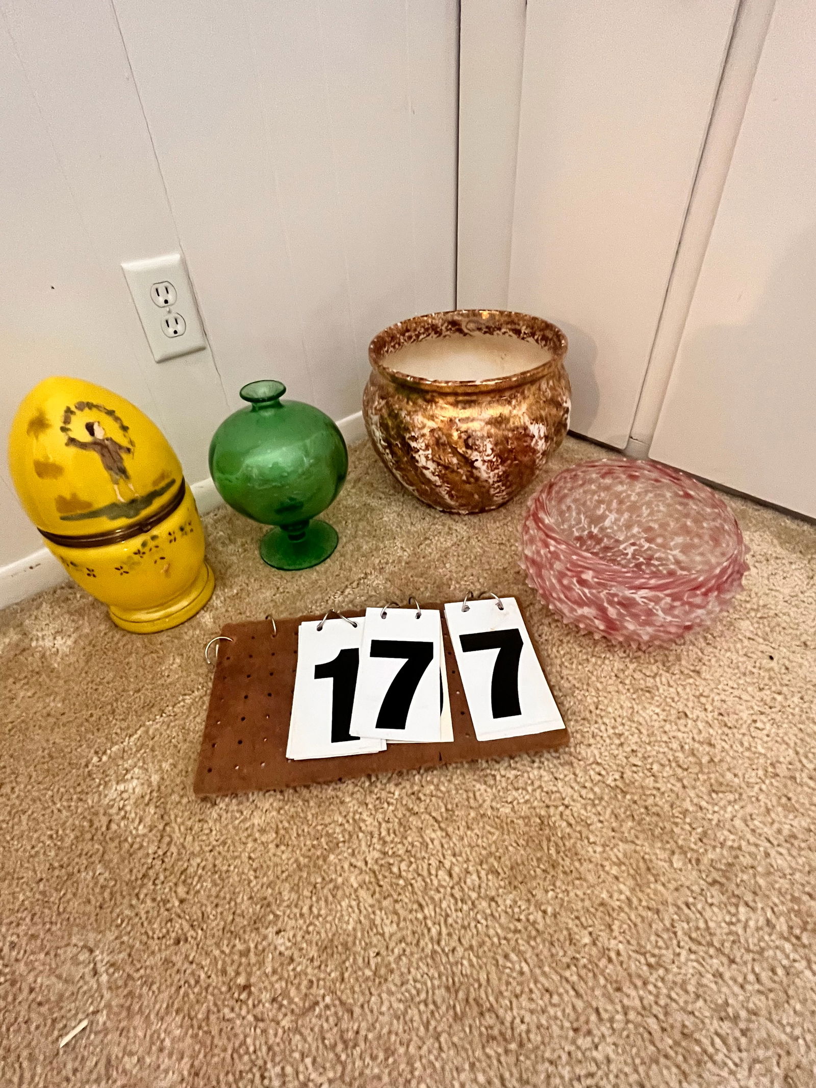 Four Antique Glass and Porcelain Items: Four antique glass and porcelain items. One 1900s lift top decanter with child holding flowers. Contains six glasses and stoppered bottle. 11.75"h. One controlled bubble, possibly Pairpoint, with grou
