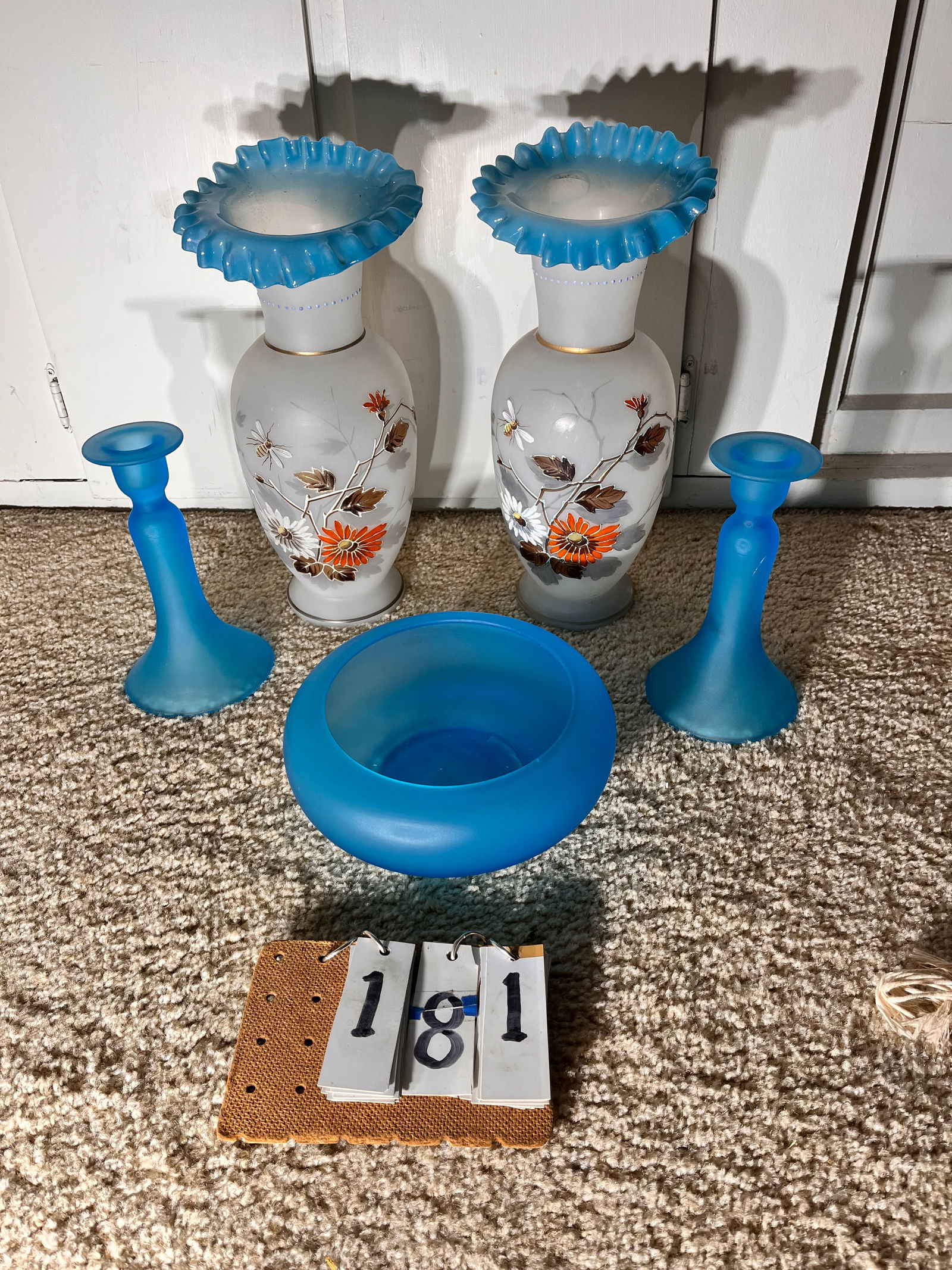 Five Antique Glass Pieces: Five antique glass pieces. One pair of hand blown vases with flowers and bumble bee. 6" dia. x 14.5"h. Three piece set of antique blue satin glass. Bowl is 9" dia. Candlesticks are 4.5" dia. x 8"h. Fr