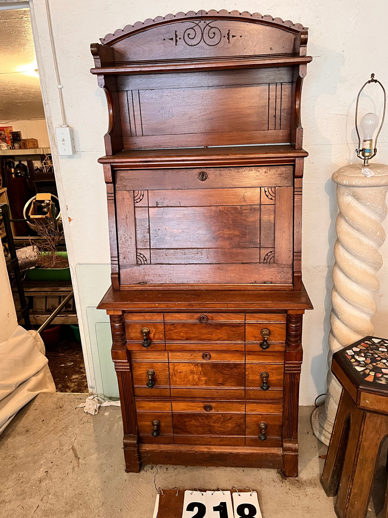 1890s Walnut Narrow Slant Front Desk: 1890s walnut narrow slant front desk with burl walnut veneer. 29"w x 17"d x 56"h. From the Rochester, NY Estate.