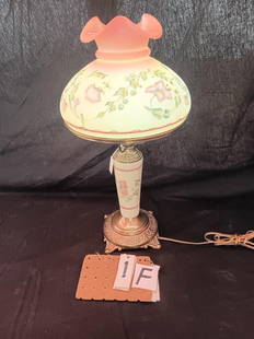 Fenton Burmese Beautiful Hand Painted 2 Part Lamp: Made by C. Mackey; there were only 750 made and this is #464/750. It has a metal matching base with Burmese insert. This is the Jacobean Floral Pattern. Burmese glass contains Uranium oxide which