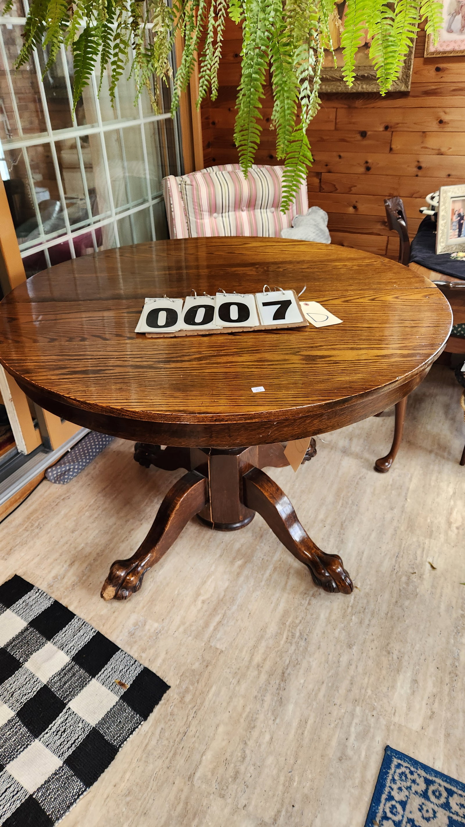 Round Solid Oak Claw Foot Table and Four Chairs: Round solid oak claw foot table and four chairs. One leg on table chewed, split top and no leaves. 44" dia. x 38.5"h. See photos. From the Estate of Buddy Hawkes, Esq., Camden, NY. Please read the Ter