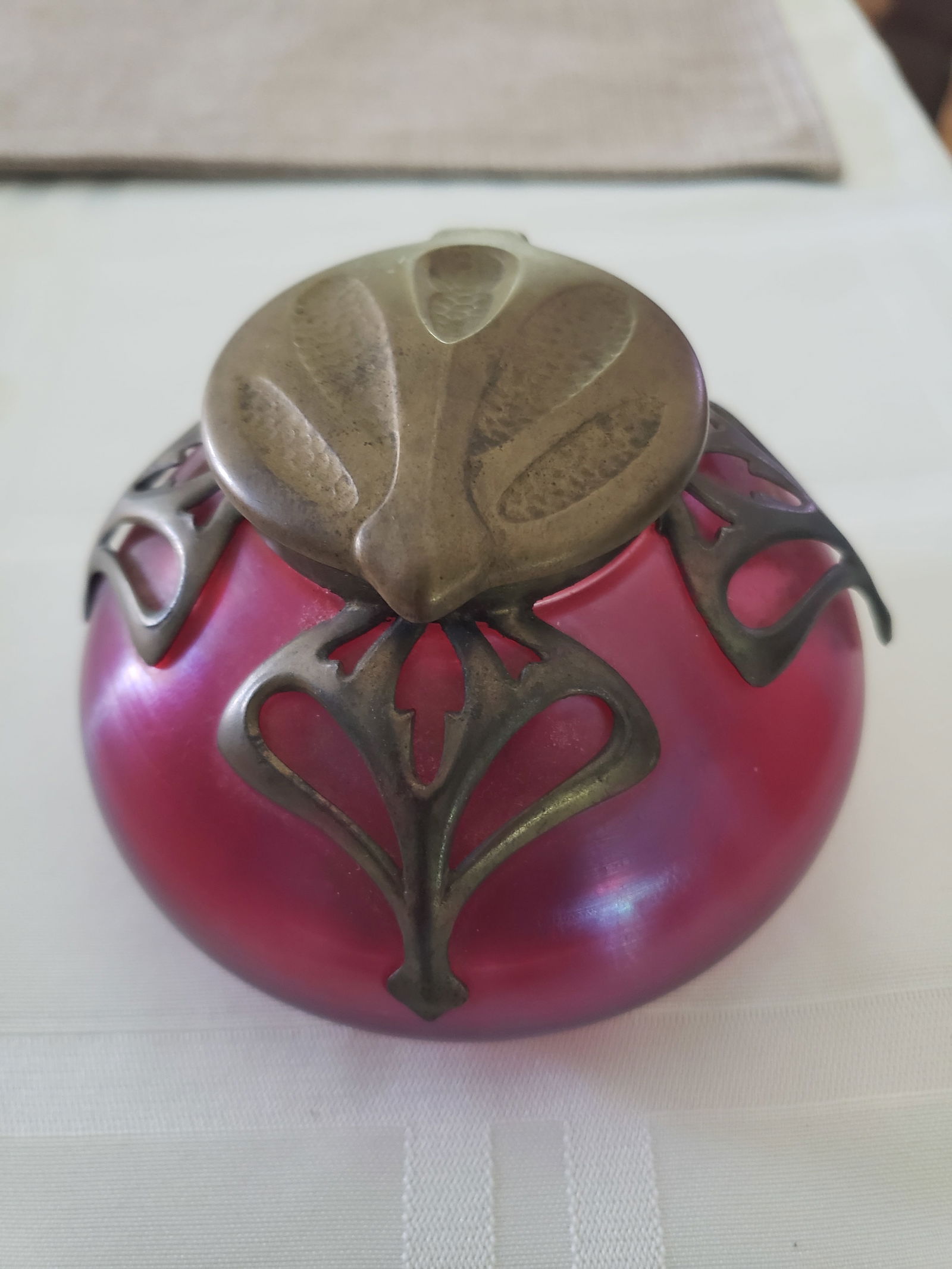1890 Loetz Cranberry and Bronze Inkwell: 1890 Loetz cranberry and bronze inkwell. 4" dia. x 2.75"h. Please read the Terms and Conditions of this auction thoroughly for IMPORTANT bidder information.