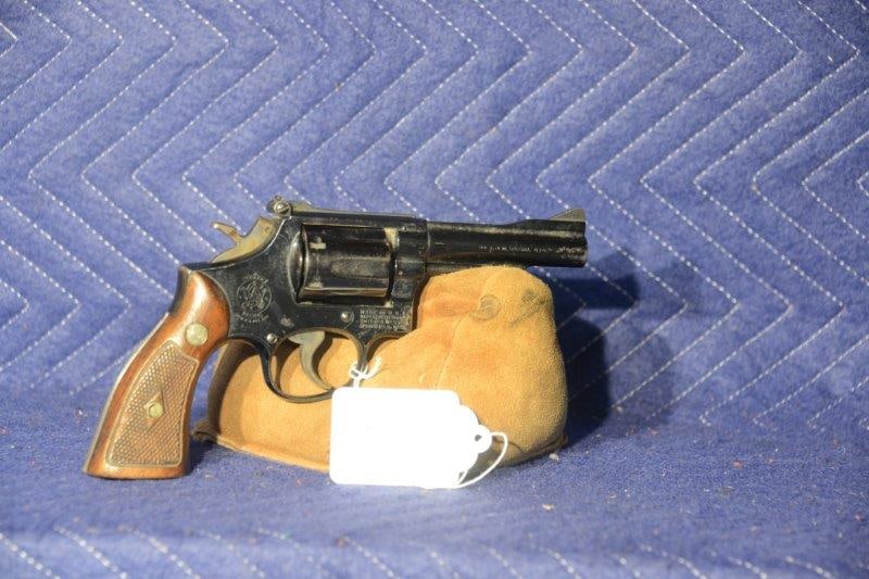 Smith & Wesson Model 15-2: Smith & Wesson Model 15-2. 38 special. 4" barrel with target sights. Rusted with pitting and blemishes on the metal finish. Serial No. K626198.