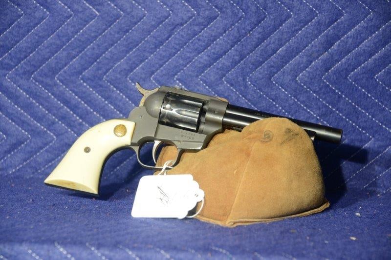 Hi-Standard Double 9 W-100: Hi-Standard Double 9 W-100. 9-shot 22LR double or single action revolver. Missing front sight. Slight pitting. Serial No. 914703.