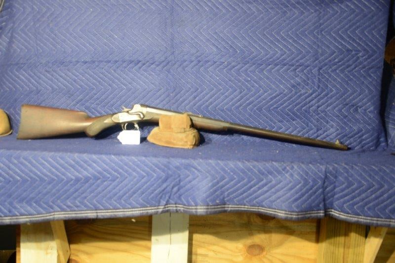 Remington Hepburn Rifle: Remington Hepburn rifle. 33.1 1/4 caliber. Palm prints on bottom of the barrel. Globe front sights. Pitting with some finish remaining. 1875 Mexican coin in stock. 28" barrel. Serial No. 5941.