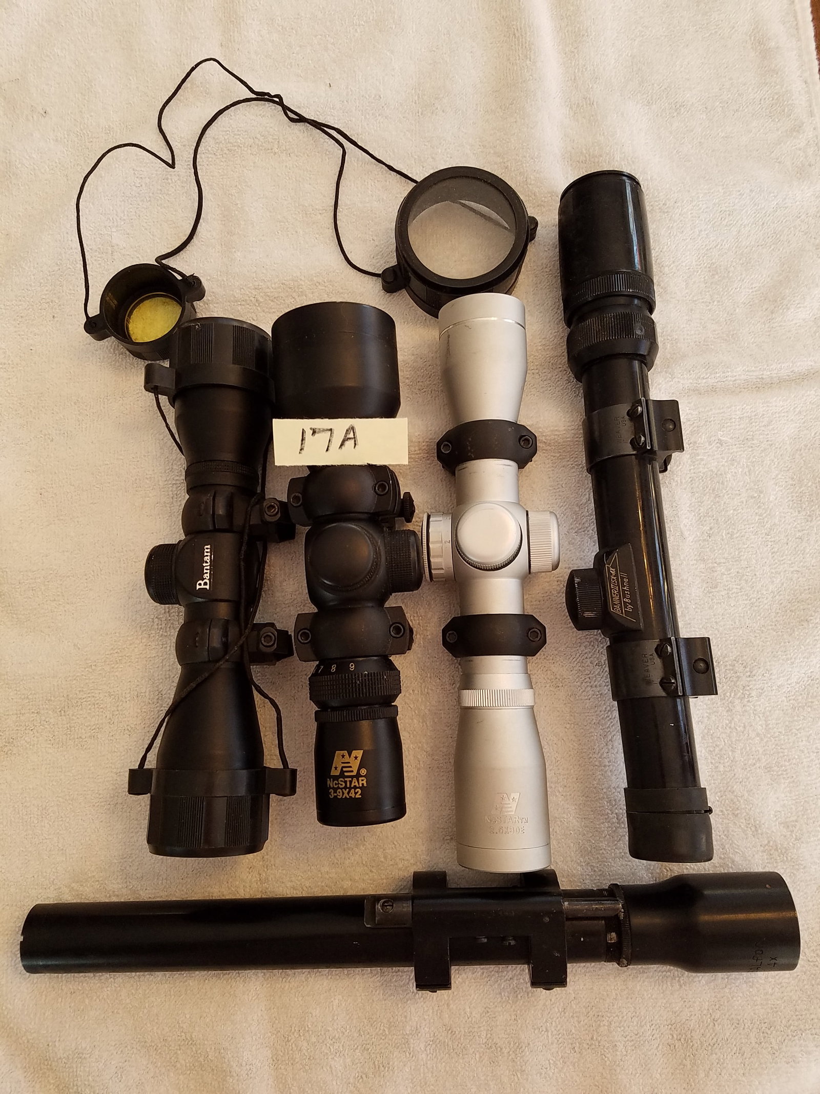 Five Rifle Scopes: Five rifle scopes. Includes one NcStar 3x9x42, one Bushnell Banner II 1.5x-4.5x, one Tasco Bantom, one NcStar 2.5x and one Bausch & Lomb Opt. Co. 4x. See photos.